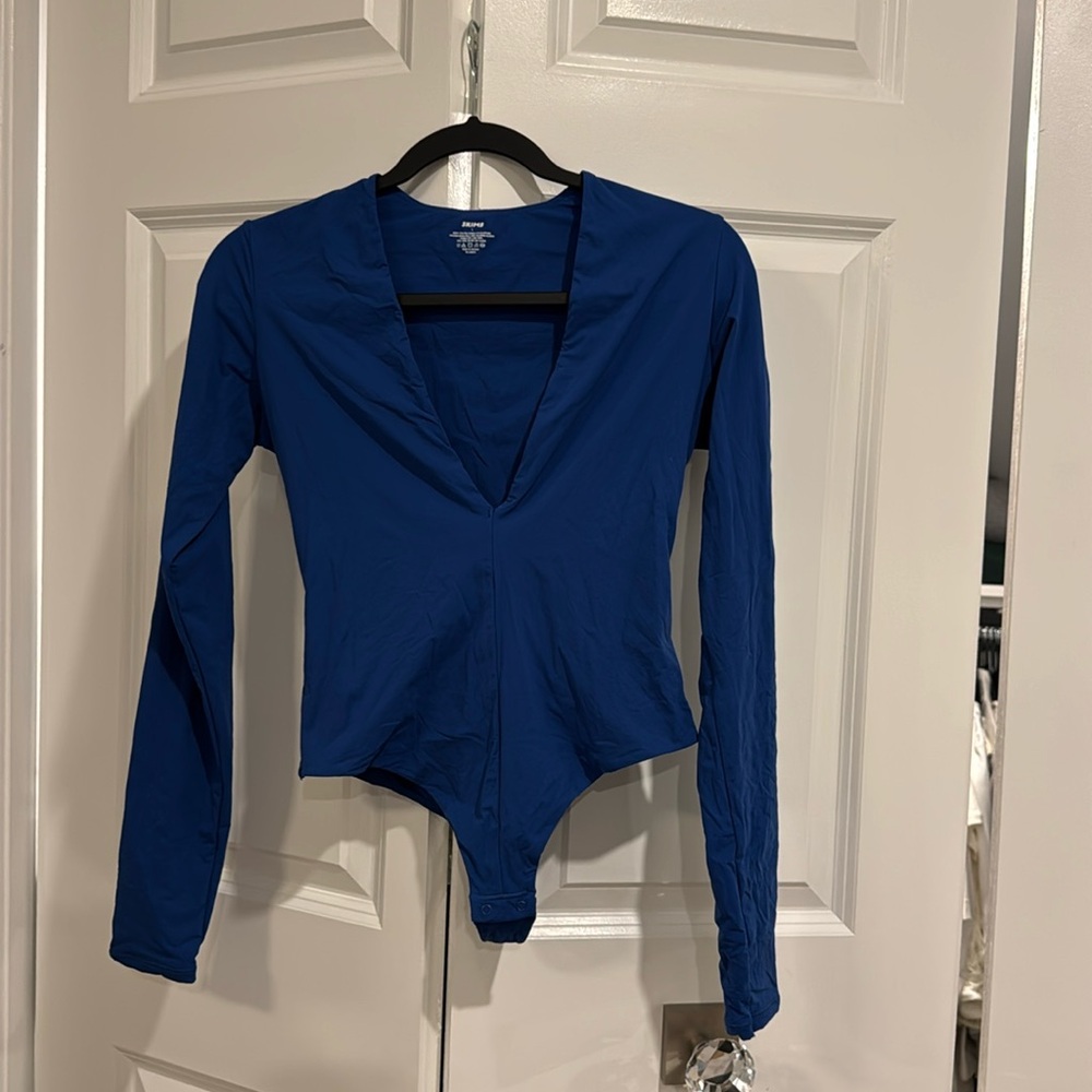 Skims bodysuit 
New without tags; Never worn